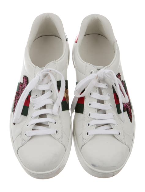 gucci embroidered sneakers.